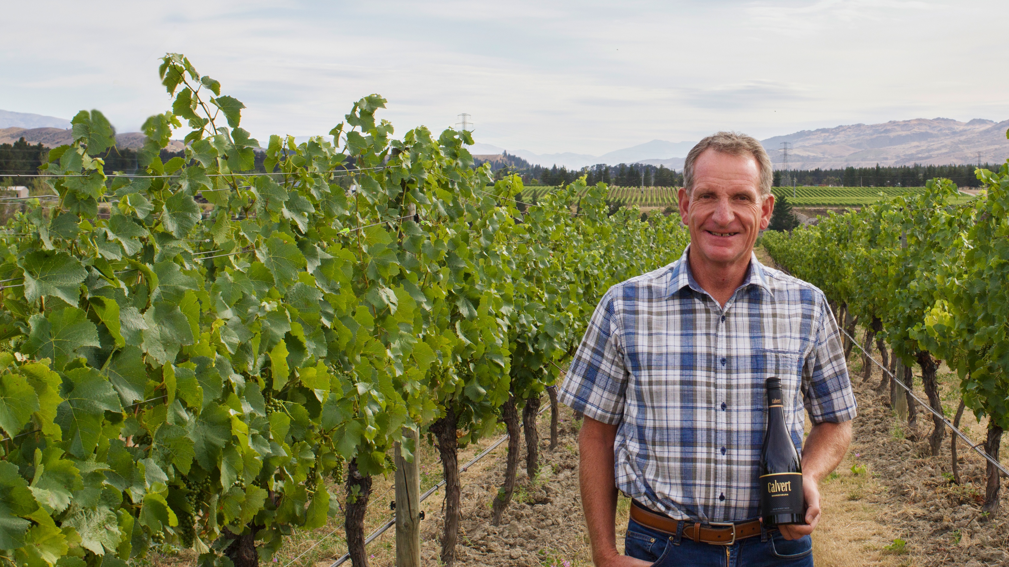 Owen Calvert standing in his Bannockburn vineyard